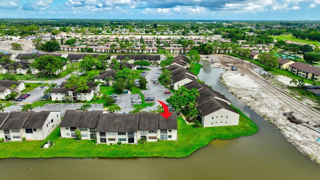 aerial view with a residential view and a water view