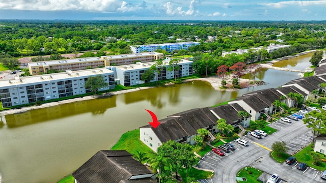 bird's eye view featuring a water view and a view of trees