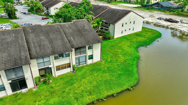 aerial view with a residential view and a water view