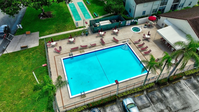 pool featuring a patio and fence