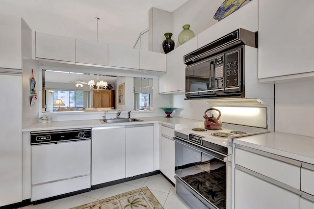 kitchen featuring white cabinetry, white appliances, and sink