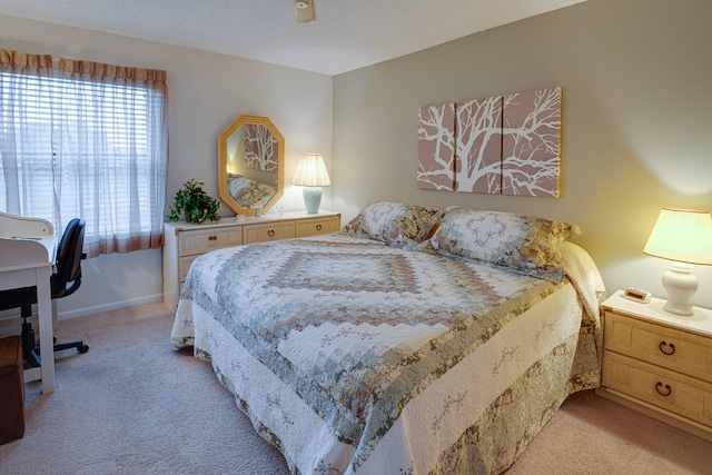 carpeted bedroom with a textured ceiling