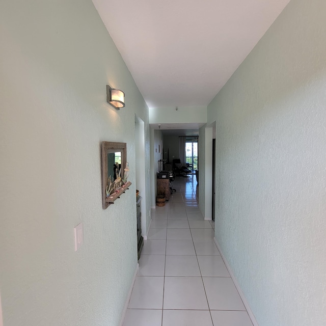 hallway with light tile patterned floors