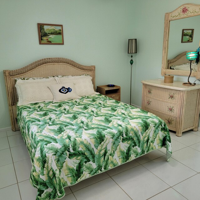 bedroom with light tile patterned floors