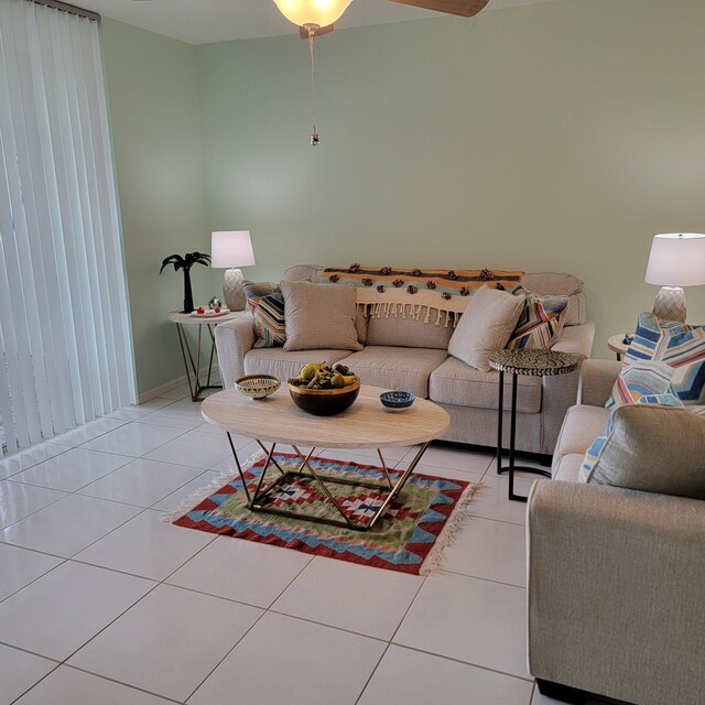 tiled living room featuring ceiling fan