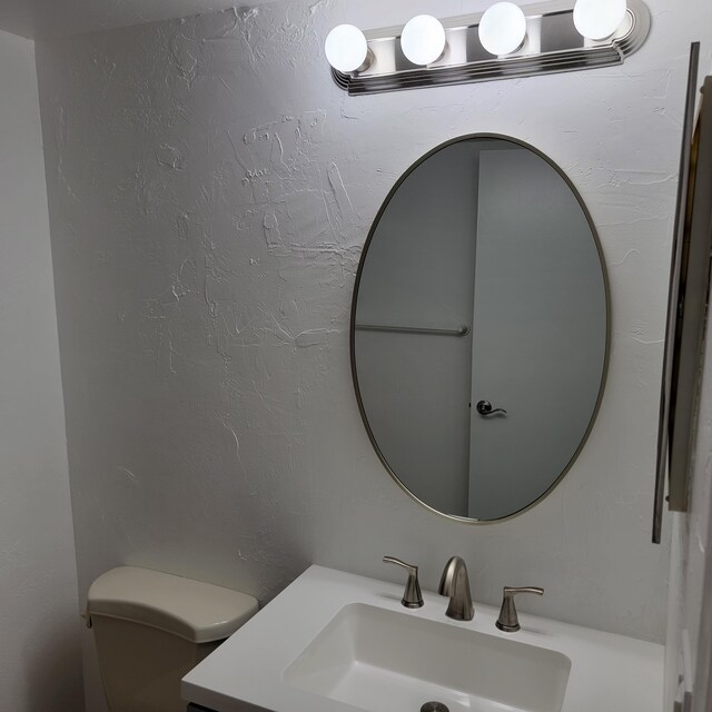 bathroom with toilet and sink