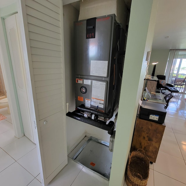 utility room featuring heating unit