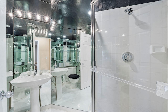 bathroom with tile patterned floors and a shower with shower door