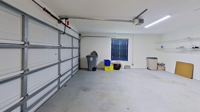 garage featuring a garage door opener