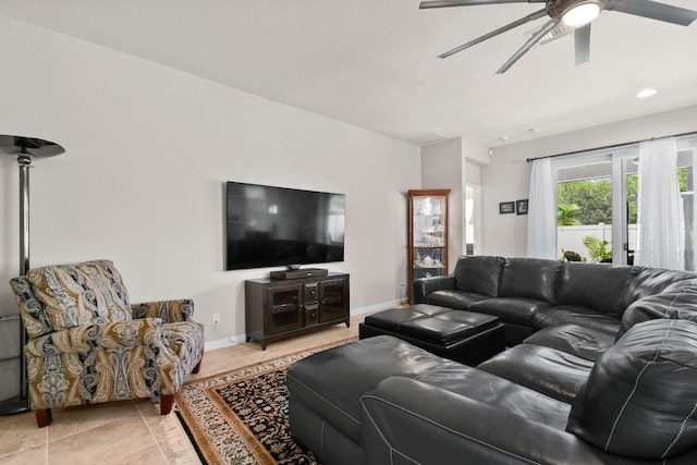 tiled living room with ceiling fan and a textured ceiling