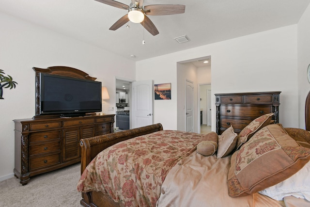 bedroom with light carpet and ceiling fan