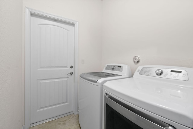 laundry room featuring washing machine and dryer