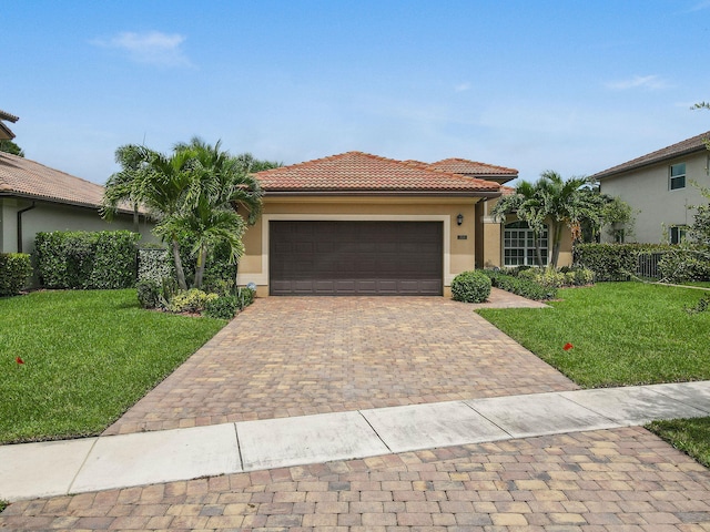 view of front facade with a garage and a front yard