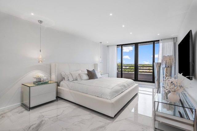 bedroom featuring access to exterior and expansive windows