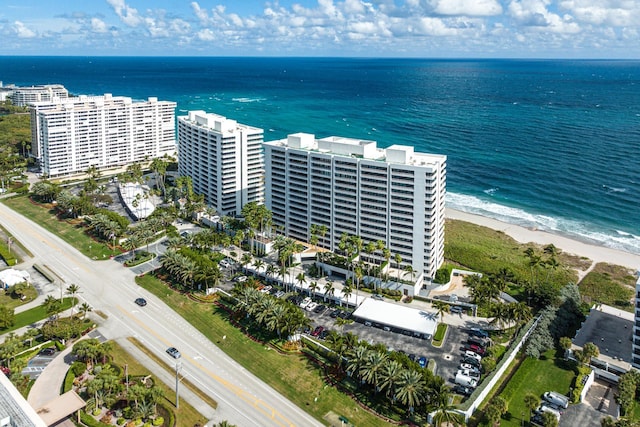 aerial view featuring a water view and a beach view