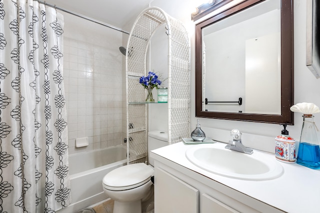 full bathroom with vanity, toilet, and shower / bath combo with shower curtain