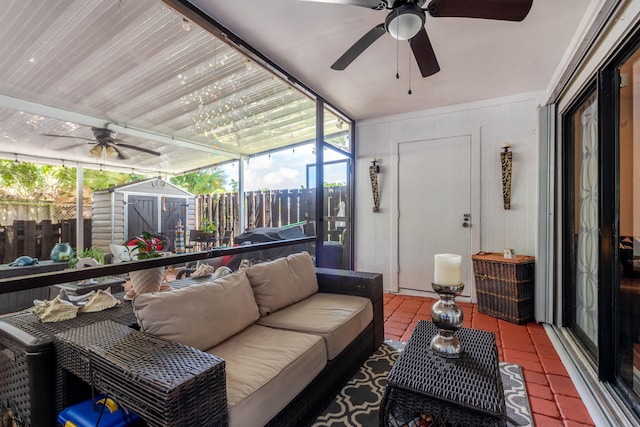 sunroom featuring ceiling fan