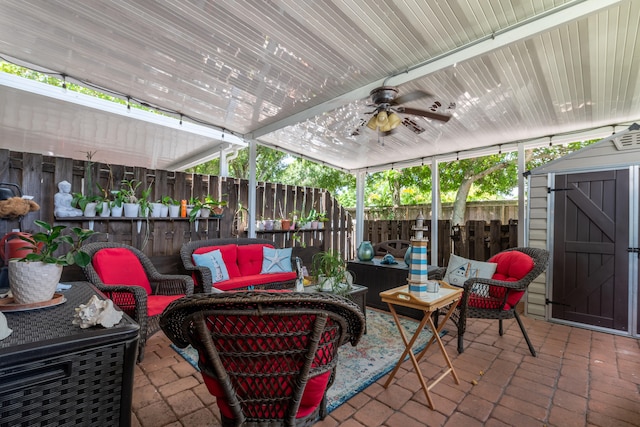 sunroom with a wealth of natural light and ceiling fan