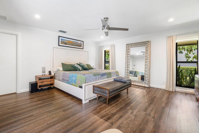 bedroom featuring ceiling fan and dark hardwood / wood-style floors