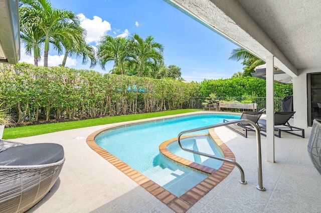 view of swimming pool featuring a patio