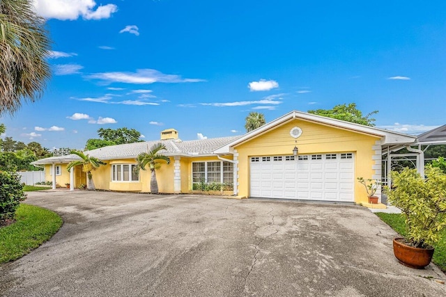 ranch-style house featuring a garage