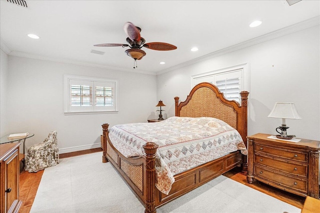 bedroom featuring recessed lighting, visible vents, light wood-style floors, and crown molding