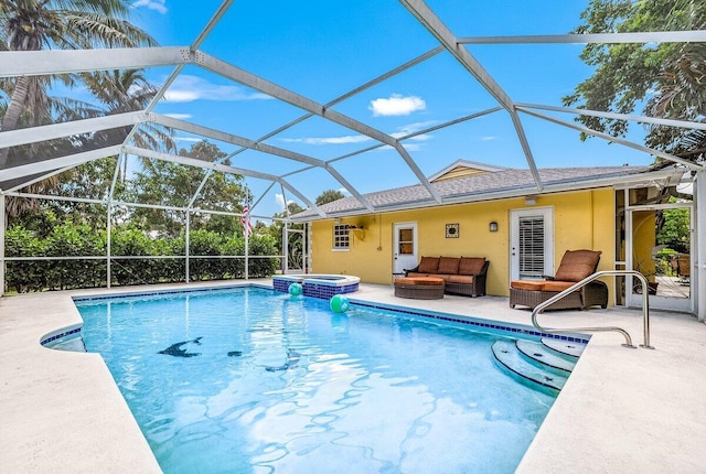 view of swimming pool featuring outdoor lounge area, a patio, glass enclosure, and a pool with connected hot tub