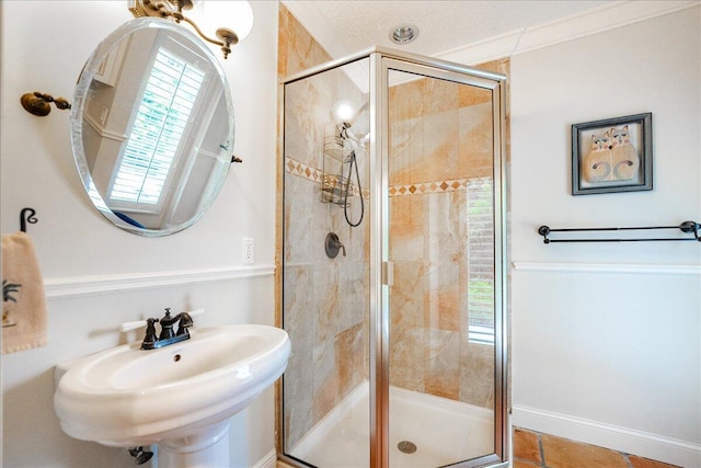 full bath featuring a sink and a stall shower