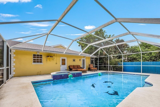 view of swimming pool featuring glass enclosure, a patio, fence, and a pool with connected hot tub