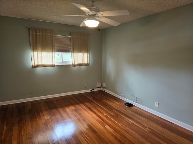 spare room featuring a textured ceiling, ceiling fan, and hardwood / wood-style floors