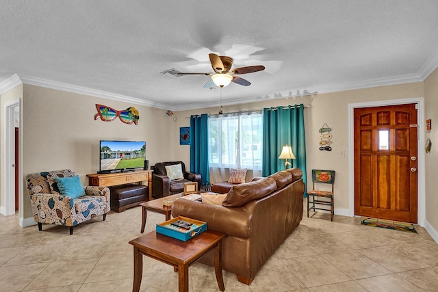 tiled living room with ceiling fan, ornamental molding, and a textured ceiling