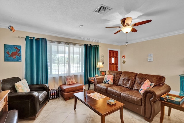 tiled living room with ceiling fan, crown molding, and a textured ceiling