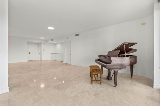 sitting room with visible vents and baseboards