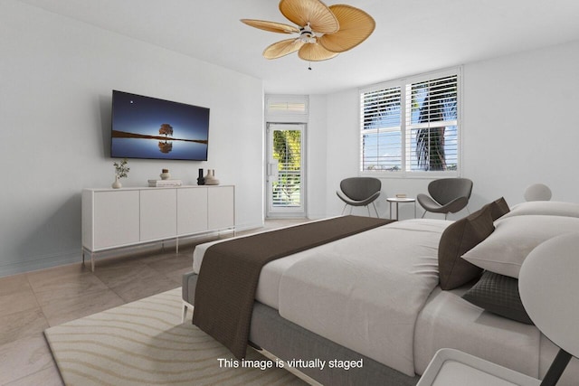 bedroom featuring baseboards and a ceiling fan