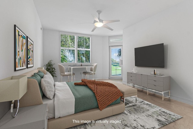 bedroom featuring ceiling fan and baseboards