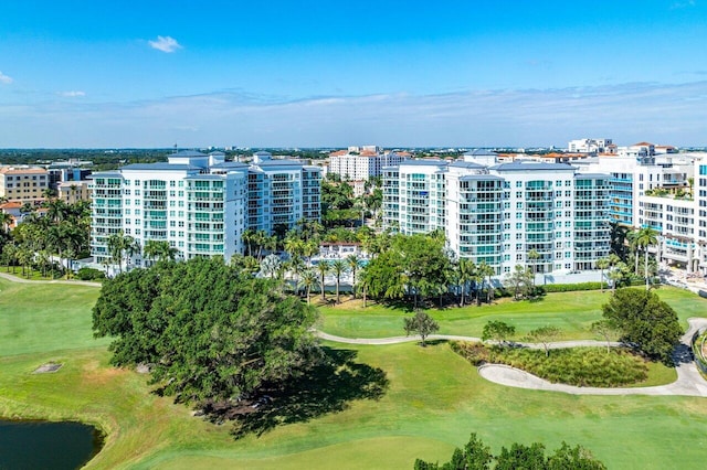 bird's eye view featuring golf course view and a city view