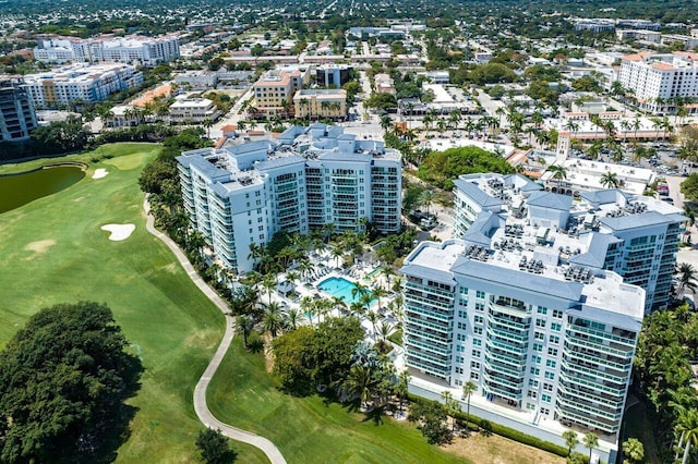 drone / aerial view with a view of city and view of golf course