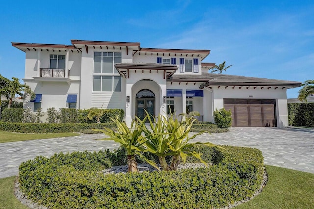 view of front of house featuring a garage and french doors