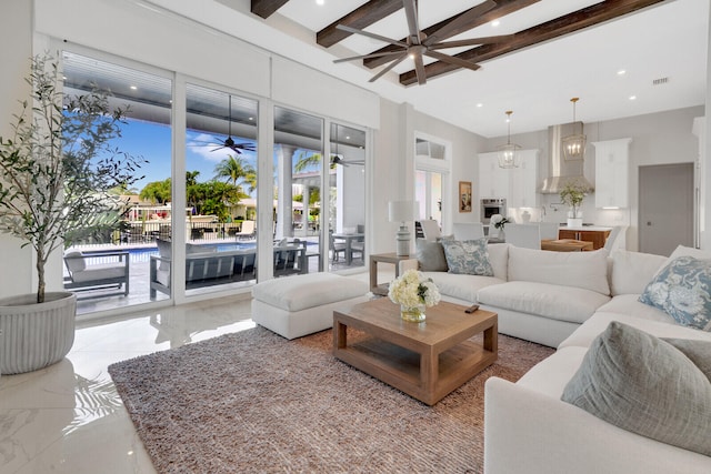 living room featuring beamed ceiling