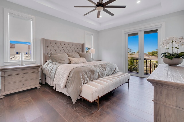 bedroom featuring access to outside, multiple windows, ceiling fan, and dark hardwood / wood-style floors