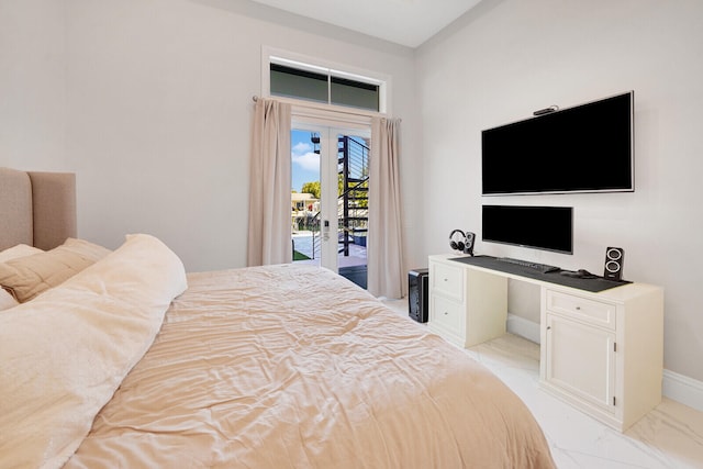 bedroom featuring french doors and access to outside