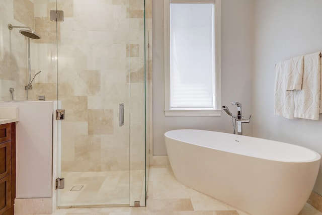 bathroom featuring tile patterned floors, vanity, and independent shower and bath