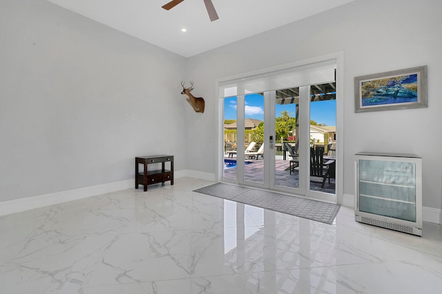 unfurnished room featuring ceiling fan and french doors