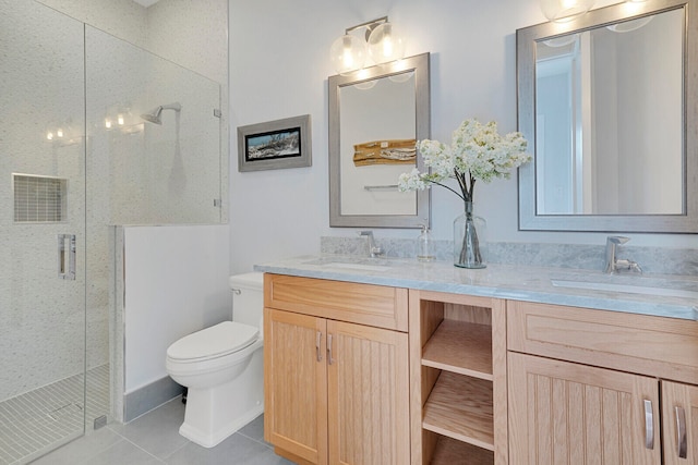 bathroom with tile patterned flooring, vanity, toilet, and an enclosed shower