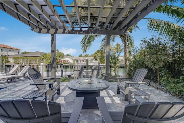 view of patio featuring a water view and a pergola