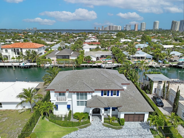 birds eye view of property with a water view