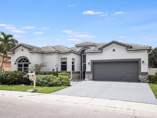 view of front of property featuring a garage