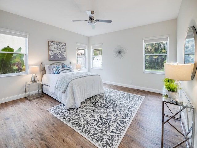 bedroom featuring hardwood / wood-style floors and ceiling fan