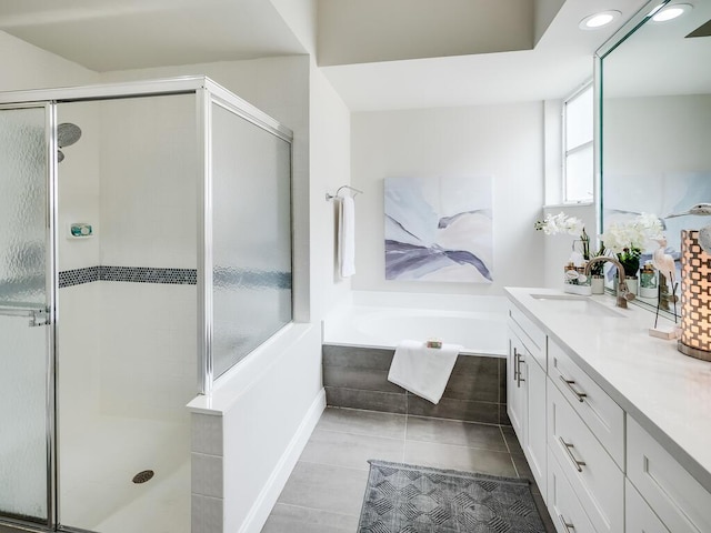 bathroom featuring tile patterned floors, vanity, and separate shower and tub