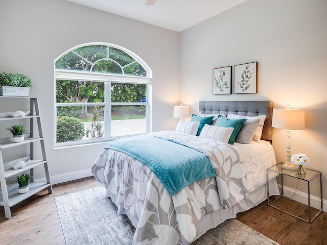 bedroom featuring ceiling fan and hardwood / wood-style floors